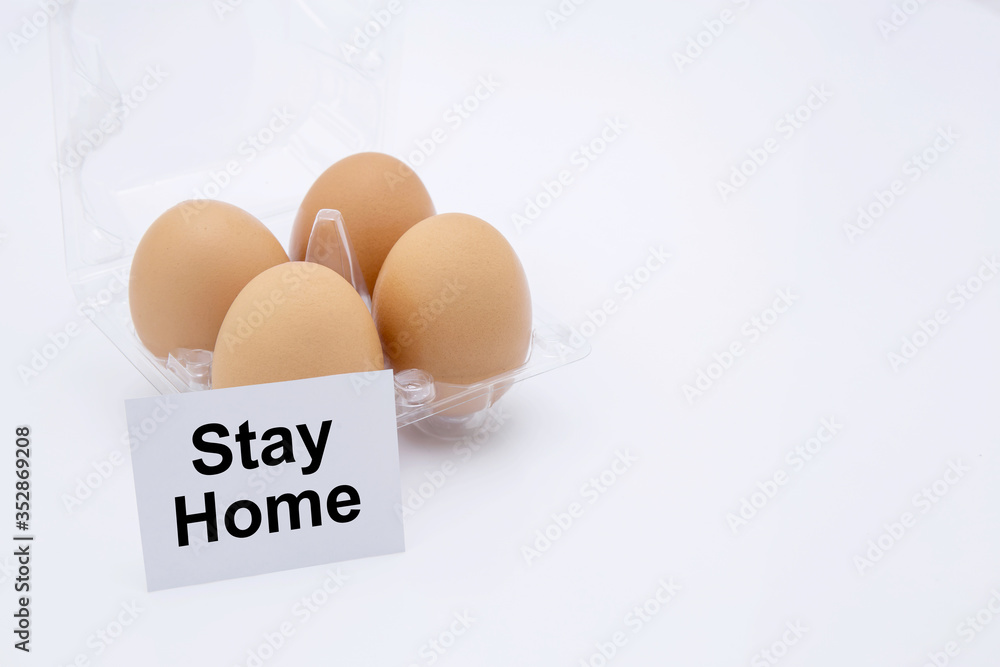 Easter egg with text stay home for protective covid-19 isolated on white background, social distancing and quarantine, stocking up on food for while pandemic coronavirus, easter day concept. Easter egg with text stay home for protective covid-19 isolated on white background, social distancing and quarantine, stocking up on food for while pandemic coronavirus, easter day concept.
