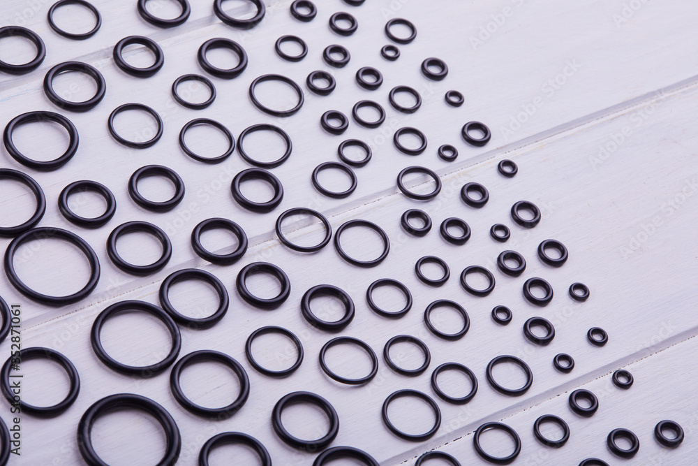 Black hydraulic and pneumatic oring seals of different sizes a white