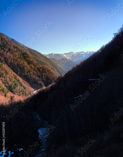 Snowy mountain landscape at sunset