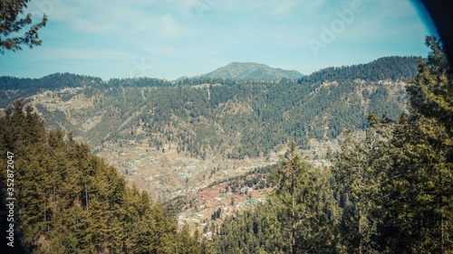 A wide view of village by the hills