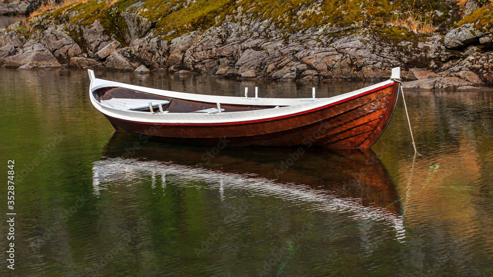 Norwegian fishing boat on water in Lofoten island, Norway Norwegian fishing boat on water in Lofoten island, Norway