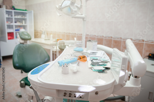 Dental clinic office with chair. Dental office dentist tools. Medical equipment and dentistry.
