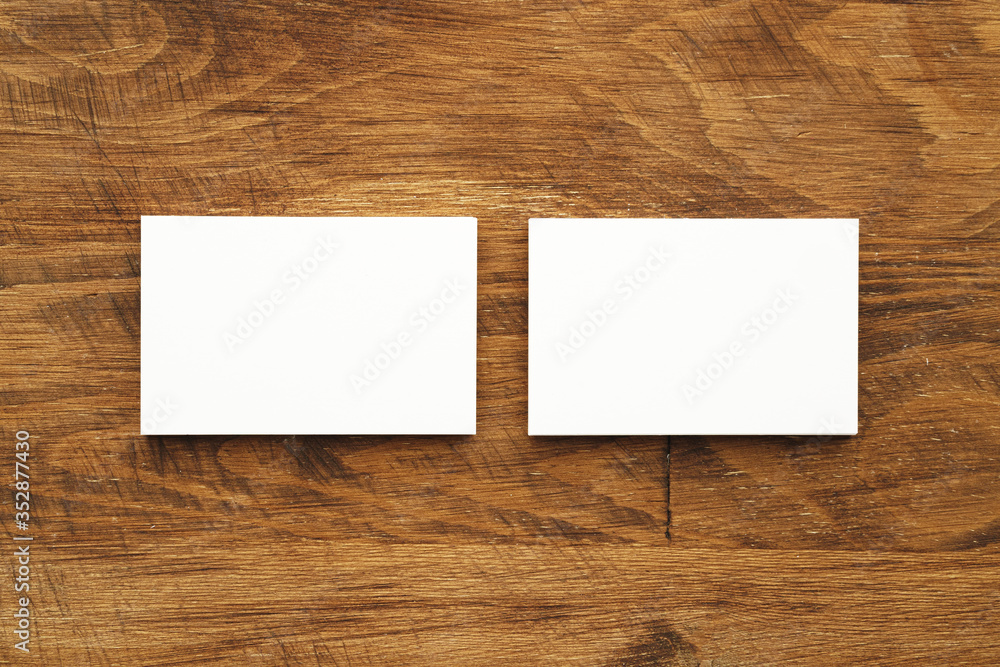 Stacks of businesscards with copy space on wooden background Stacks of businesscards with copy space on wooden background