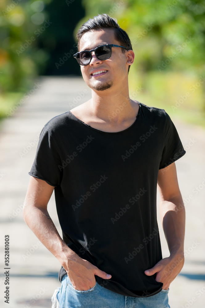 portrait of a young man with sunglasses portrait of a young man with sunglasses