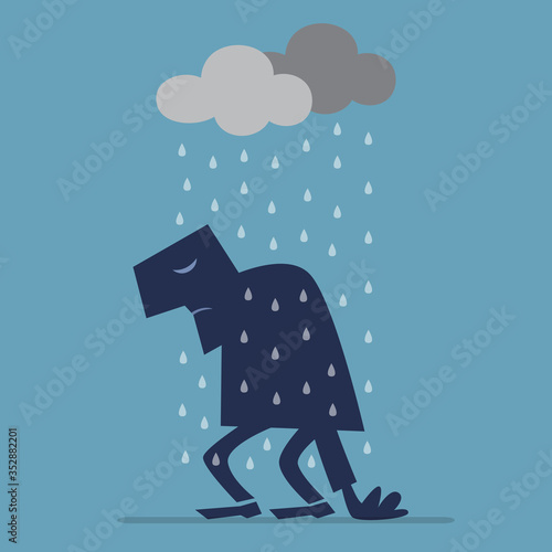 Depressed man walking under Rain Cloud