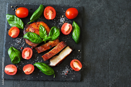 Meat steak with basil and cherry tomatoes. Paleo. Pegan. Keto diet.