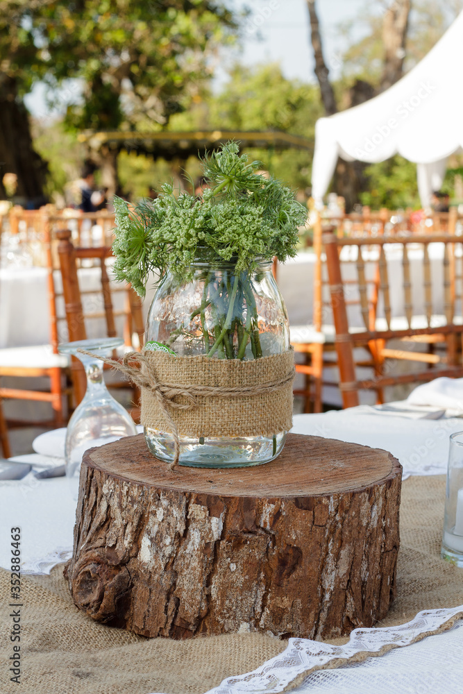 Fototapeta premium Flowers with unique pots on the table