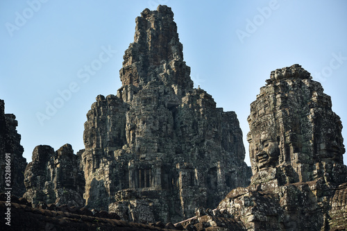 Bayon Temple with ancient giant stone faces of king, Angkor Wat, Siem Reap, Cambodia.