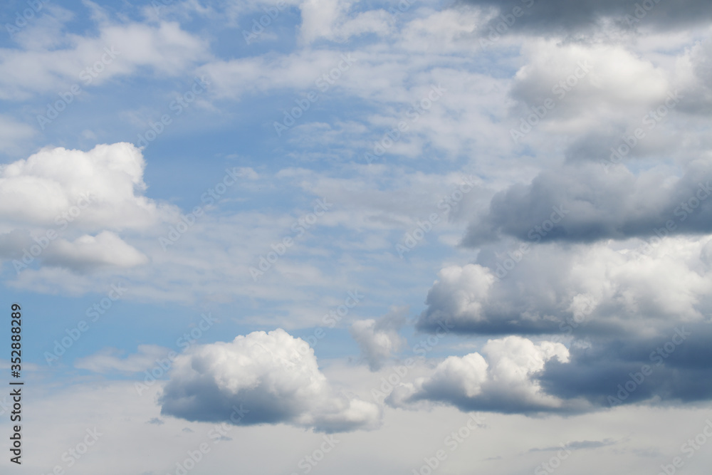 Small thunderclouds against a piercing blue sky Small thunderclouds against a piercing blue sky