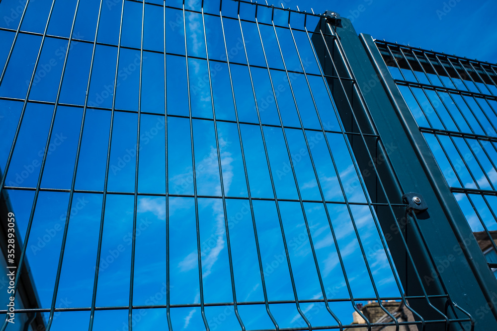 Fototapeta premium Black metal security gates protecting property
