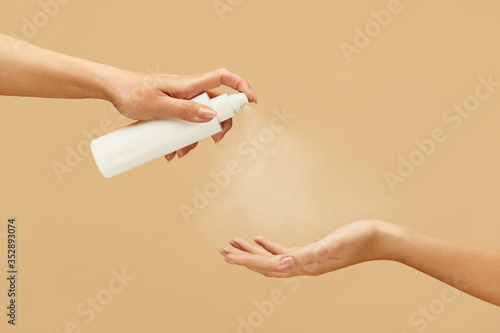 Wallpaper Mural Sanitizer. Female Hands Using Spray Antiseptic On Beige Background. Daily Hygiene Routine With Antibacterial Products For Virus Prevention And Staying Healthy. Torontodigital.ca