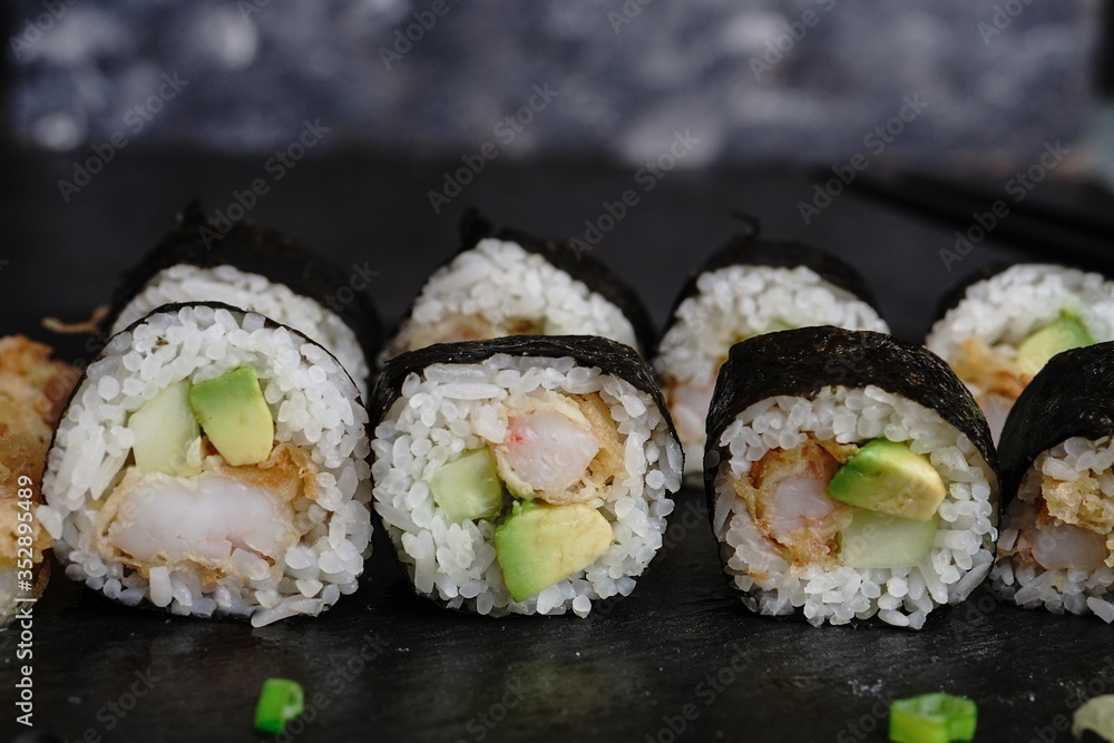 Homemade shrimp tempura sushi roll, selective focus Homemade shrimp tempura sushi roll, selective focus