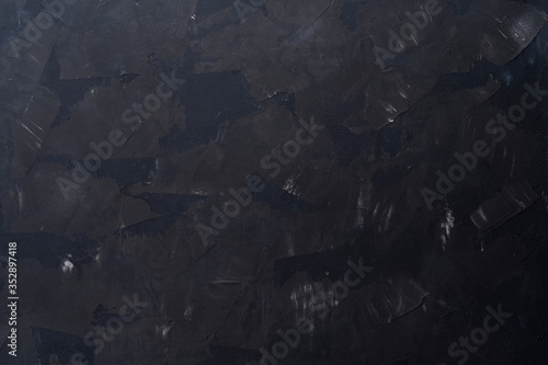 Black stone texture, dark slate background, top view