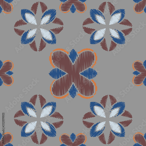 Colorful Ikat ornamentel seamless pattern for textile, wallpaper, card or wrapping paper. Tile for surface design photo