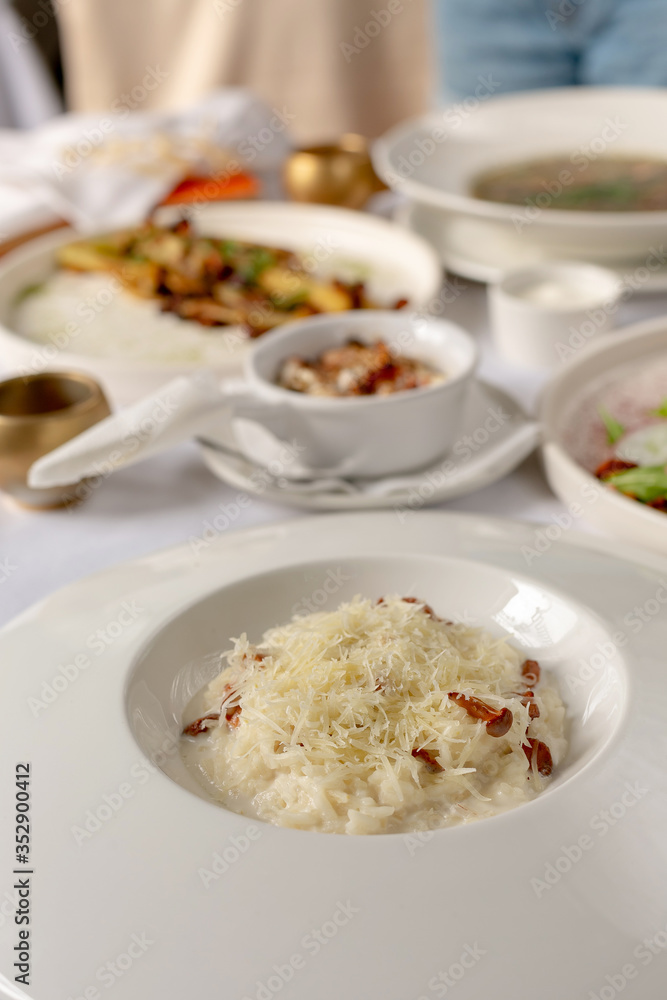 Close-up risotto with chanterelle mushrooms and grated parmesan Close-up risotto with chanterelle mushrooms and grated parmesan