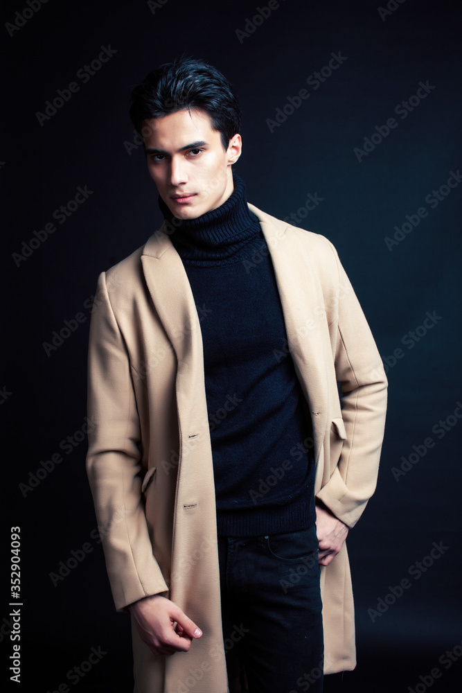 handsome asian fashion looking man posing in studio on black background, lifestyle modern people concept handsome asian fashion looking man posing in studio on black background, lifestyle modern people concept