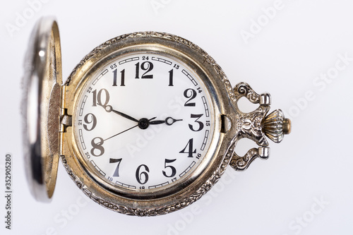 Antique analog pocket watch with hands and numbers. Vintage pocket watch