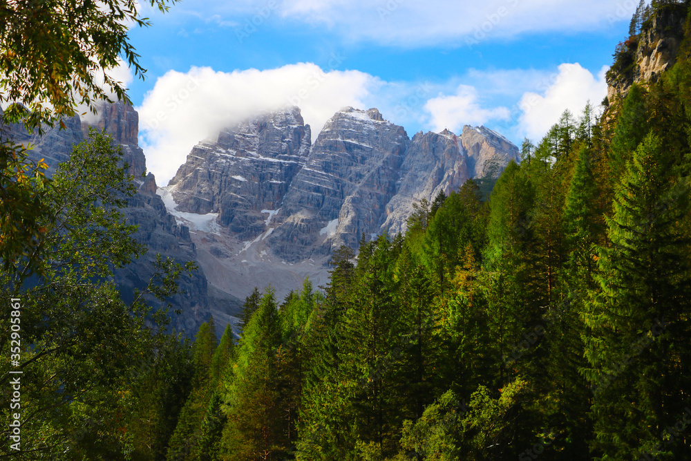 Fototapeta premium Beautiful summer landscape, fantastic alpine pass and high mountains, Dolomites, Italy, Europe. Out of focus.