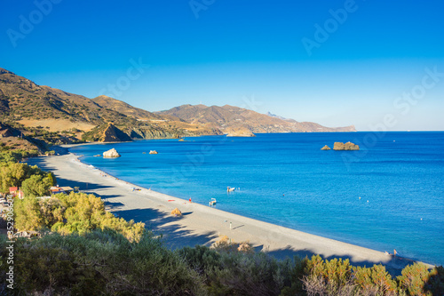 Kaloi Limenes or Kali Limenes is a small village with amazing beaches in southern Crete, Greece, with a major oil storage and terminal facility, located on the small island of Agios Pavlos. photo