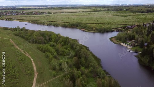 Aerial: Country landscape and flying over the lake. New Moscow area near Kamenka village, Russia.
Color graded.