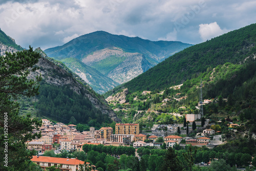 A picturesque wide panoramic view of a French village in the valley of Var in the Alps mountains (Puget-Theniers, Alpes-Maritimes, France)