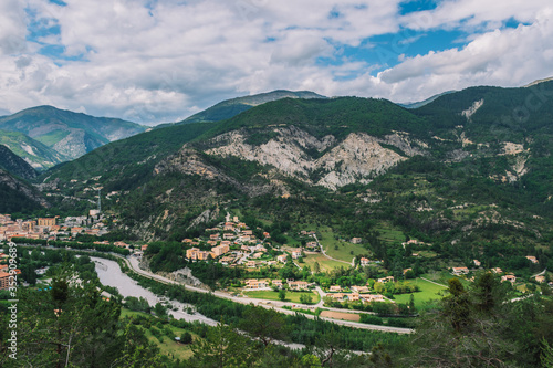 A picturesque wide panoramic view of a French village in the valley of Var in the Alps mountains  Puget-Theniers  Alpes-Maritimes  France 