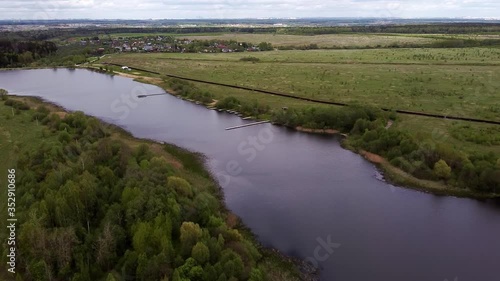 Aerial: Country landscape and flying over the lake. New Moscow area near Kamenka village, Russia.
Color graded.