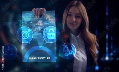 Business, Technology, Internet and network concept. Young businessman working on a virtual screen of the future and sees the inscription: Transformation