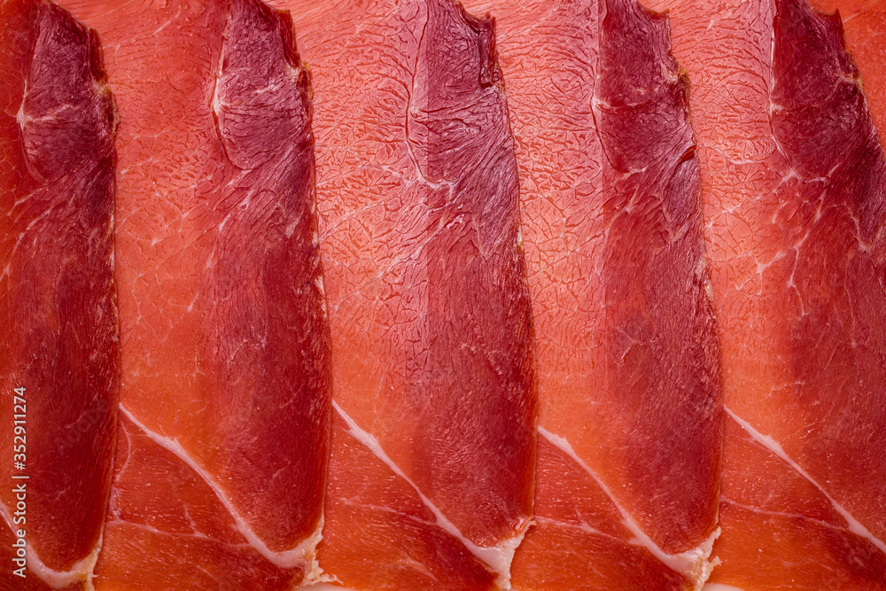 Tasty meat background, thinly sliced jamon. Tasty meat background, thinly sliced jamon.