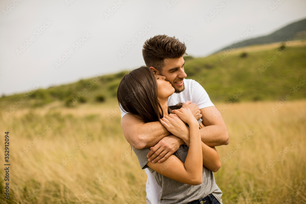Young couple in love outside in spring nature Young couple in love outside in spring nature