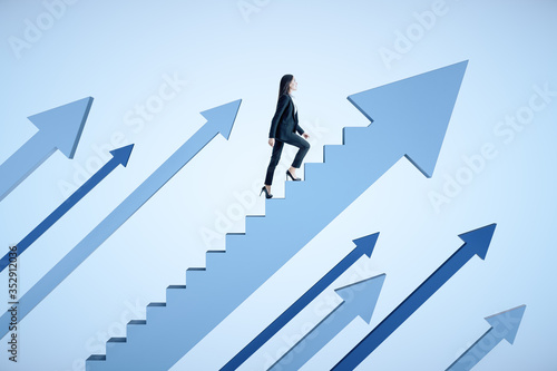 Businesswoman climbs stairs in form arrow on blue background.