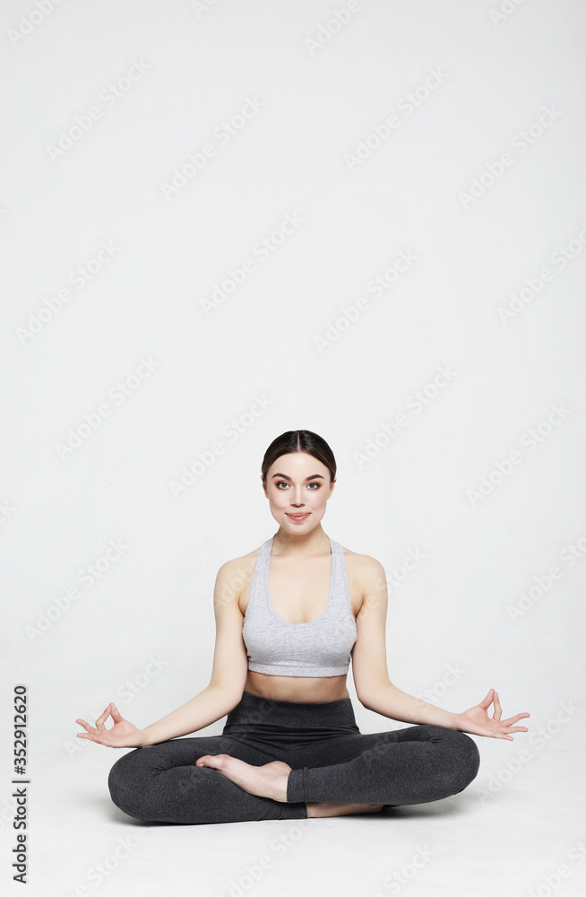 Fototapeta premium young woman working yoga exercise, over white background