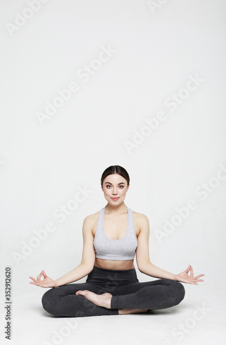 young woman working yoga exercise, over white background