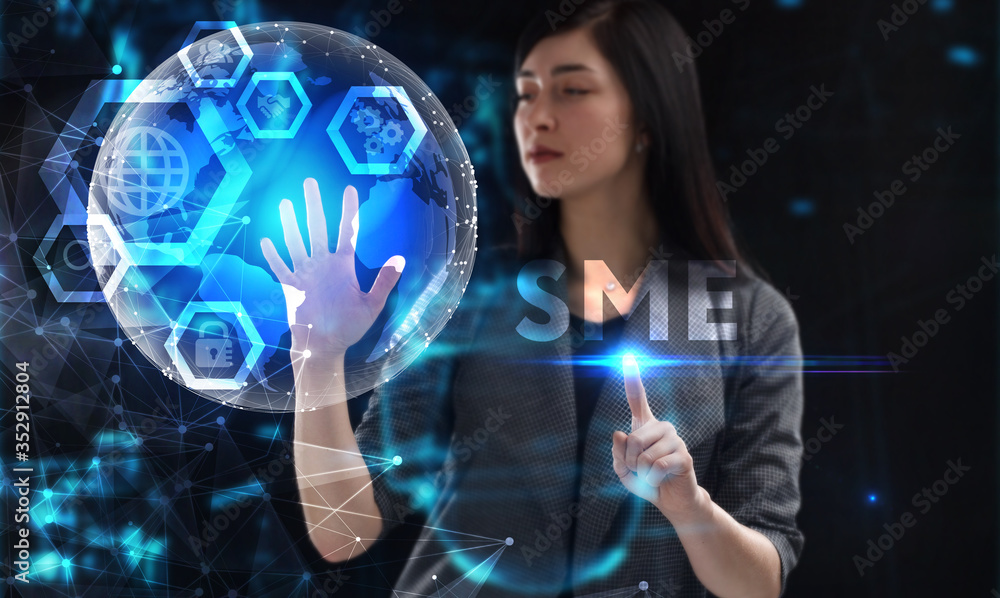Business, Technology, Internet and network concept. Young businessman working on a virtual screen of the future and sees the inscription: SME Business, Technology, Internet and network concept. Young businessman working on a virtual screen of the future and sees the inscription: SME