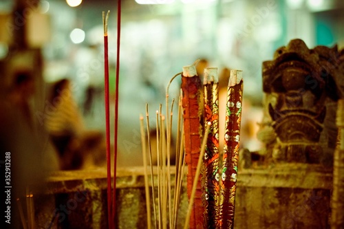 A close up of burning sticks in a pot