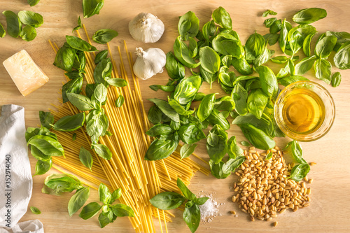 Pasta pesto genovese, spaghetti, garlic, basil, pine nuts, parmigiao, olive oil and salt photo