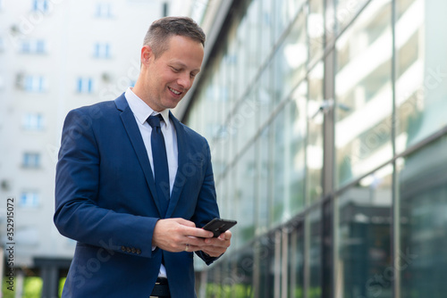 Business man using phone to send message