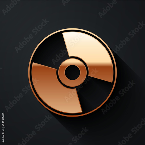 Gold CD or DVD disk icon isolated on black background. Compact disc sign. Long shadow style. Vector.
