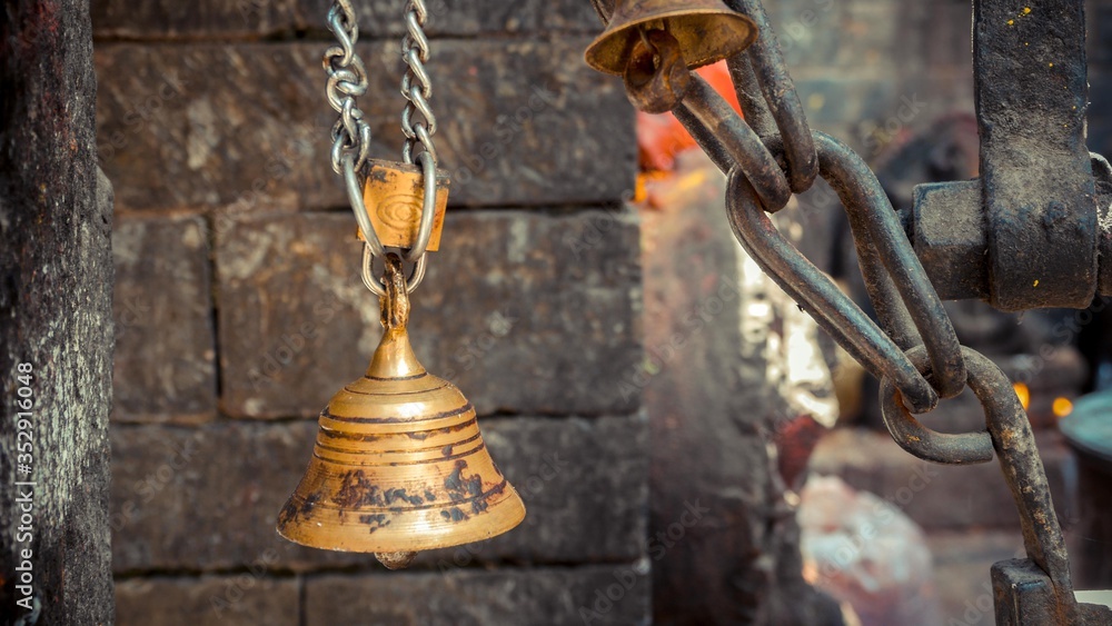 A gold bell locked together with chain A gold bell locked together with chain