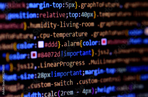 Macro of minified javascript file. Computer programming source code for HTML website development. photo