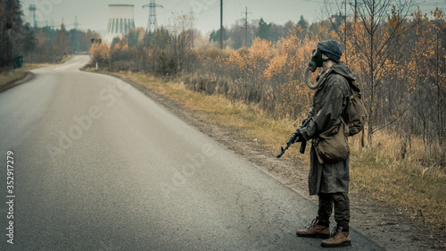 stalker with soviet gas mask in radioactive zone photo