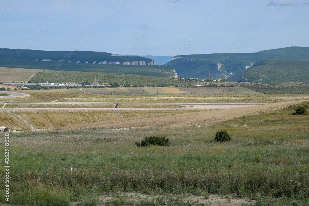 Landscapes of Crimean nature. Fields and hills visible from the car window from the road. Landscapes of Crimean nature. Fields and hills visible from the car window from the road.