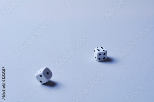 Two dice in motion, on white background,