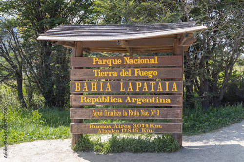 End of Pan-American highway - wooden road sign near End of the World, Lapataia bay in Tierra del Fuego national park, Ushuaia, Argentina