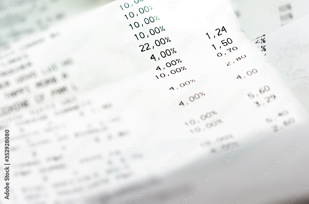 a paper receipt with the list of economic issues. Business and economics. a paper receipt with the list of economic issues. Business and economics.