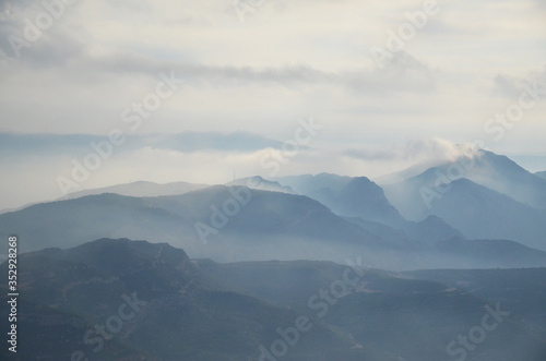 A misty morning at Monserrat. Montserrat is a multi-peaked rocky range located near the city of Barcelona, in Catalonia, Spain.