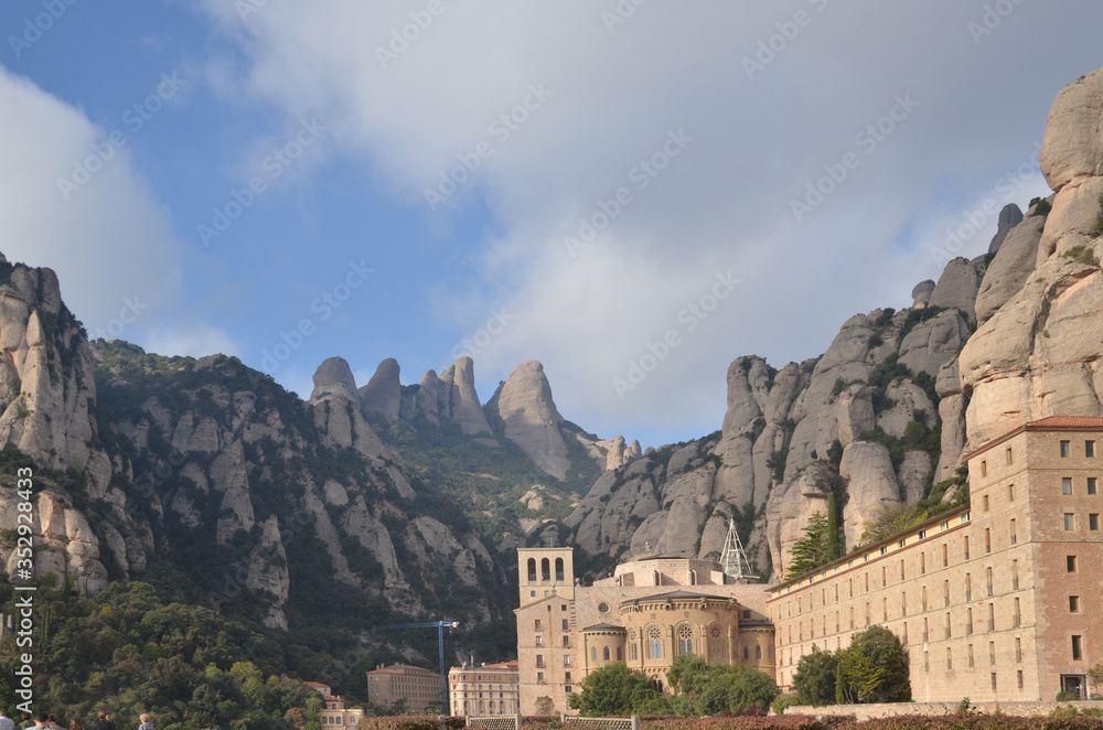 Montserrat is a multi-peaked mountain range near Barcelona, in Catalonia, Spain. It is part of the Catalan Pre-Coastal Range Montserrat is a multi-peaked mountain range near Barcelona, in Catalonia, Spain. It is part of the Catalan Pre-Coastal Range