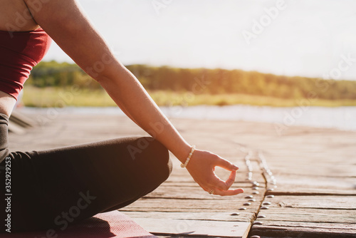 Young woman doing yoga meditation outdoors