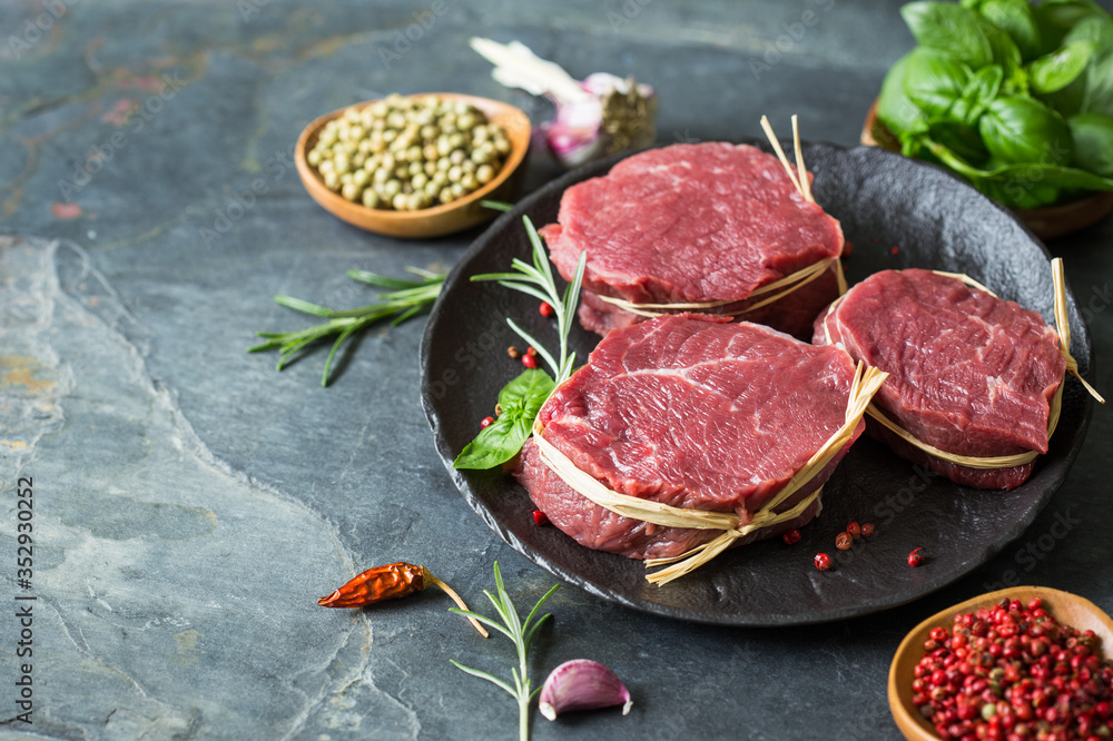 Raw organic beef steak with spices Raw organic beef steak with spices