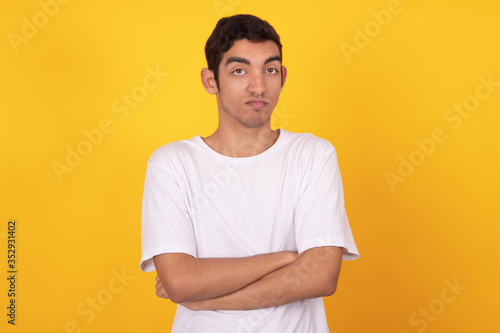 young male teenager isolated on white background wearing shirt